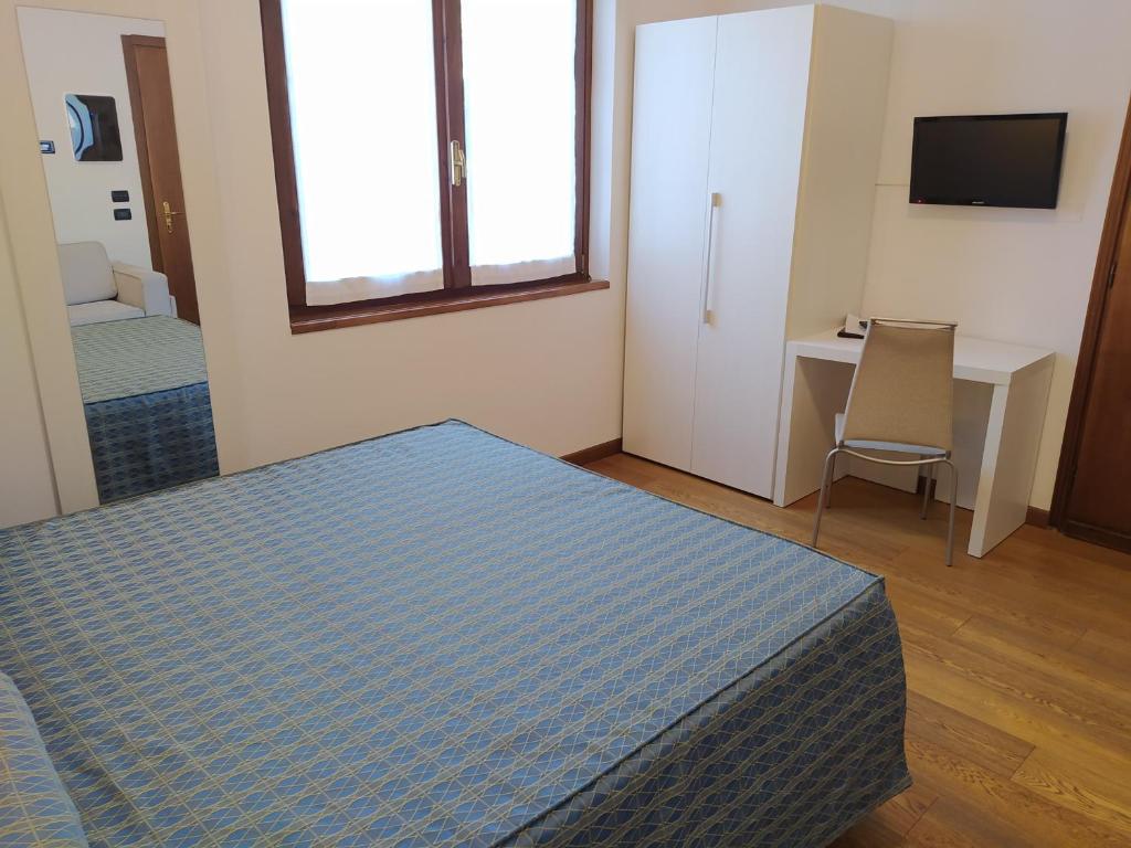 Postel nebo postele na pokoji v ubytování Albergo Ristorante Orazio