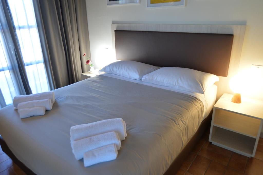 A bed or beds in a room at Villa Nadar