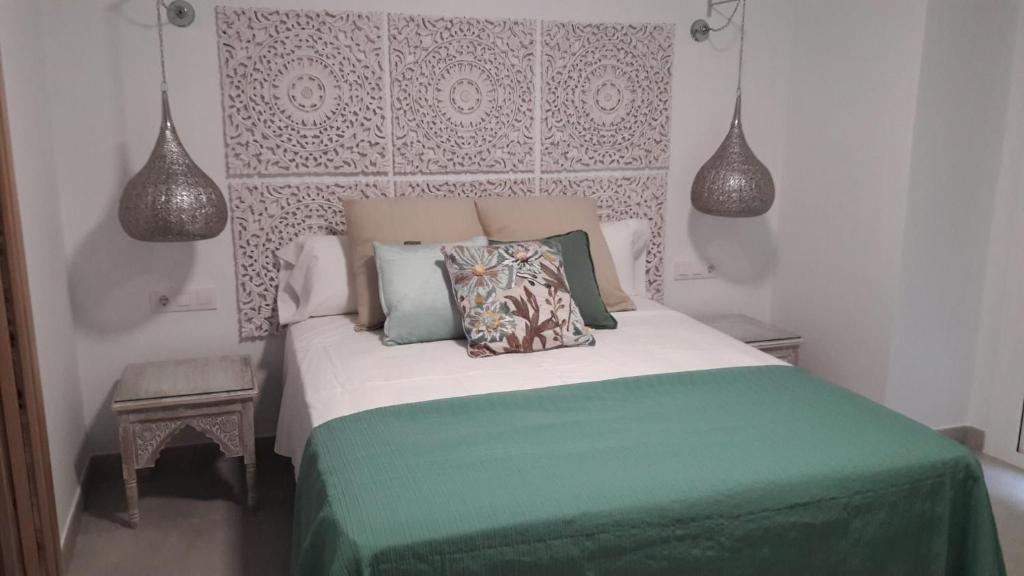 Postel nebo postele na pokoji v ubytování Hostal Cervantes Playa