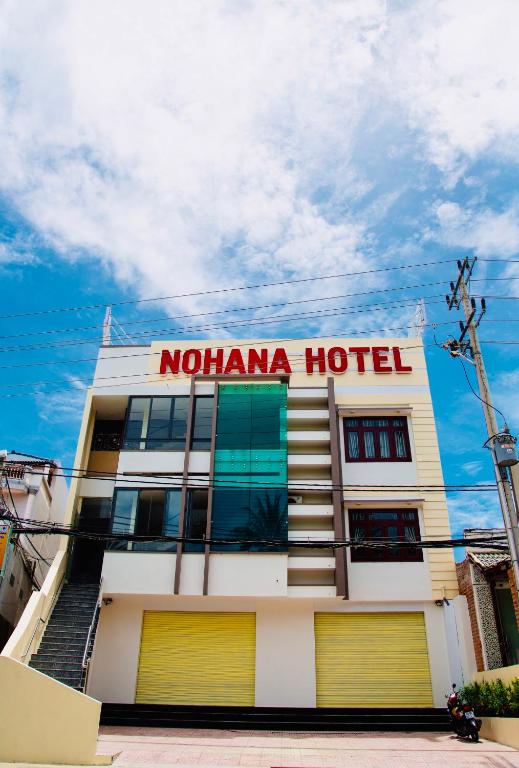 a hotel with a sign on the side of it at Nohana Hotel in Mui Ne