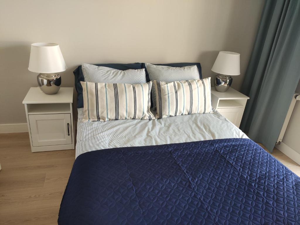 Posteľ alebo postele v izbe v ubytovaní Masuria Apartaments Ełk Nadjeziorna
