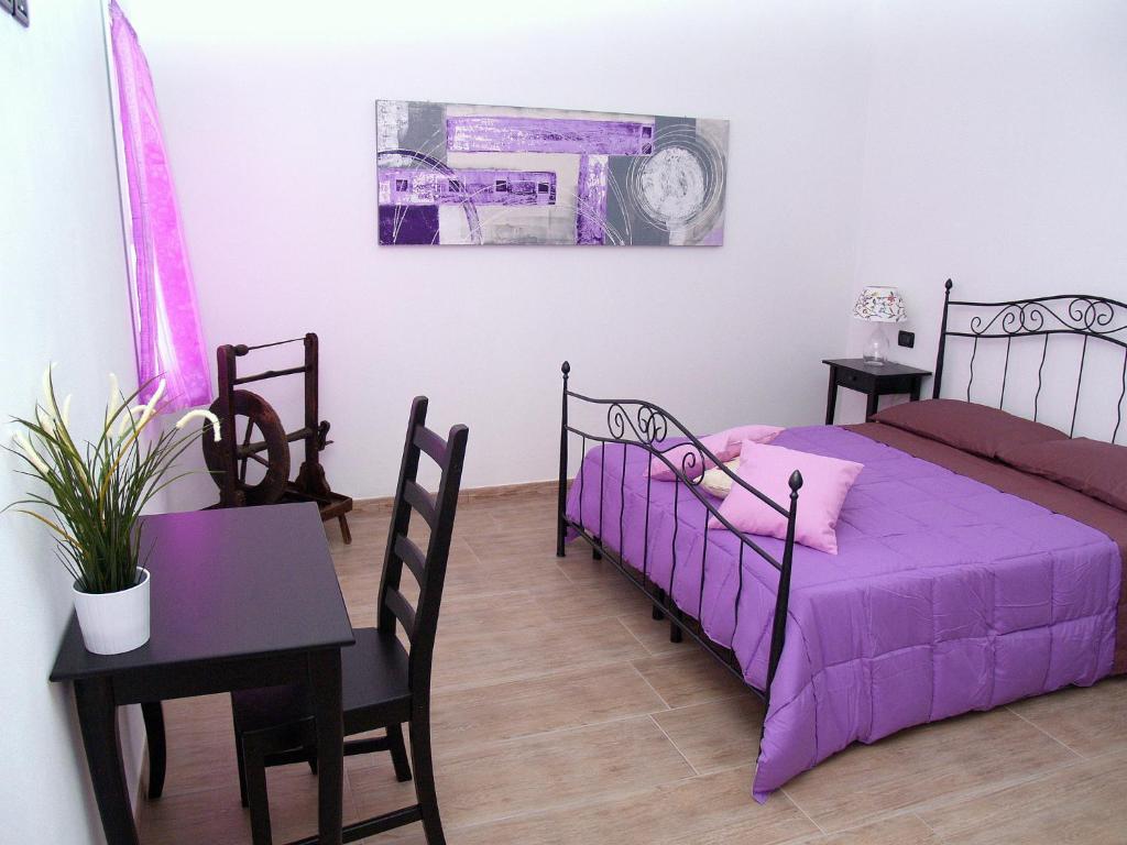 Posteľ alebo postele v izbe v ubytovaní R&B Locanda Le Bighe