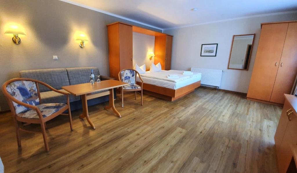 Postel nebo postele na pokoji v ubytování R&R Villen Baabe
