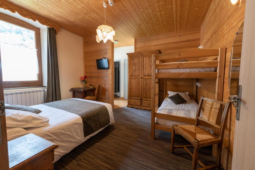 Postel nebo postele na pokoji v ubytování Hotel la Pointe Percee