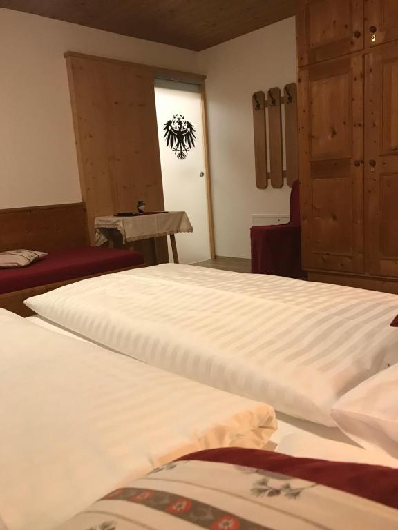 Postel nebo postele na pokoji v ubytování Das Enzian