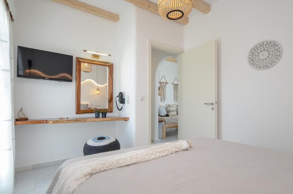 Postel nebo postele na pokoji v ubytování Birikos Studios & Apartments