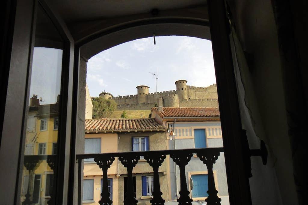 a view of a castle from a window at La casa Trivala in Carcassonne