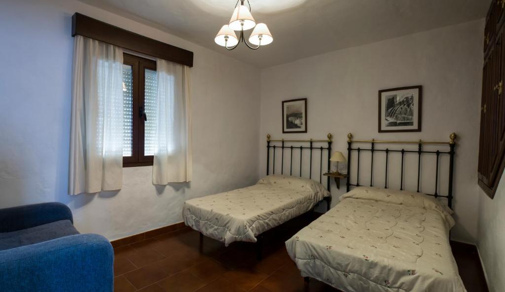 En eller flere senger på et rom på Casa Rural la callejita