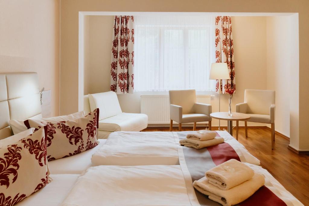 Postel nebo postele na pokoji v ubytování Hotel An den Bleichen