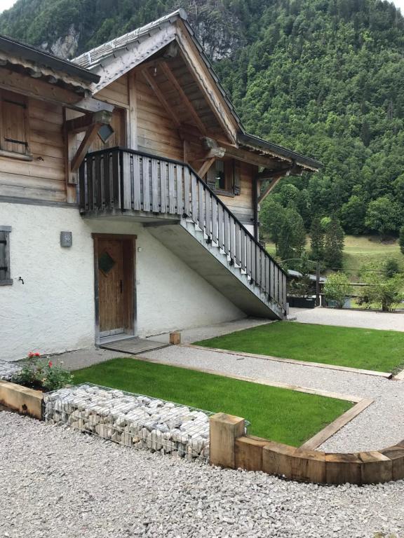 a house with a staircase on the side of it at Chalet La R'Batte in Sixt