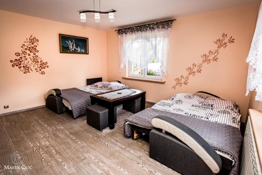 Posteľ alebo postele v izbe v ubytovaní Pokoje u Honoraty