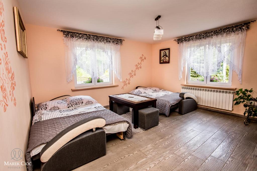 Posteľ alebo postele v izbe v ubytovaní Pokoje u Honoraty