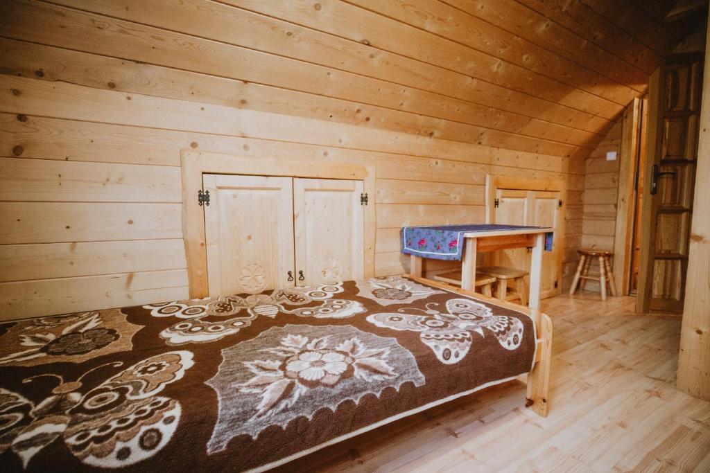 Postel nebo postele na pokoji v ubytování Domki i Pokoje obok Term Chochołów U Tadka