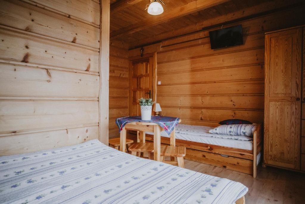 Postel nebo postele na pokoji v ubytování Domki i Pokoje obok Term Chochołów U Tadka