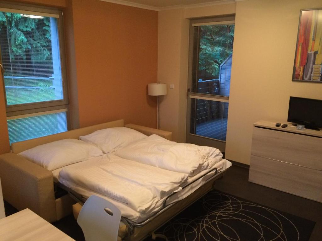 Postel nebo postele na pokoji v ubytování Apartman Harrachov