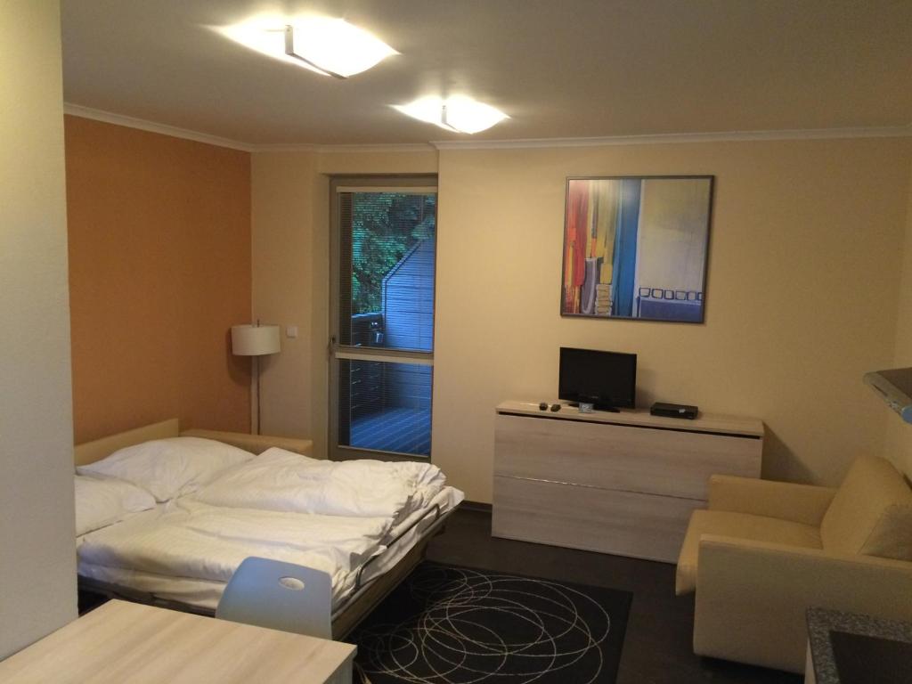 Postel nebo postele na pokoji v ubytování Apartman Harrachov