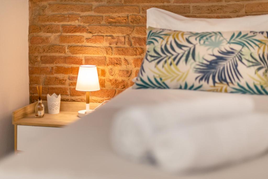 Łóżko lub łóżka w pokoju w obiekcie LUI Tuscany Loft