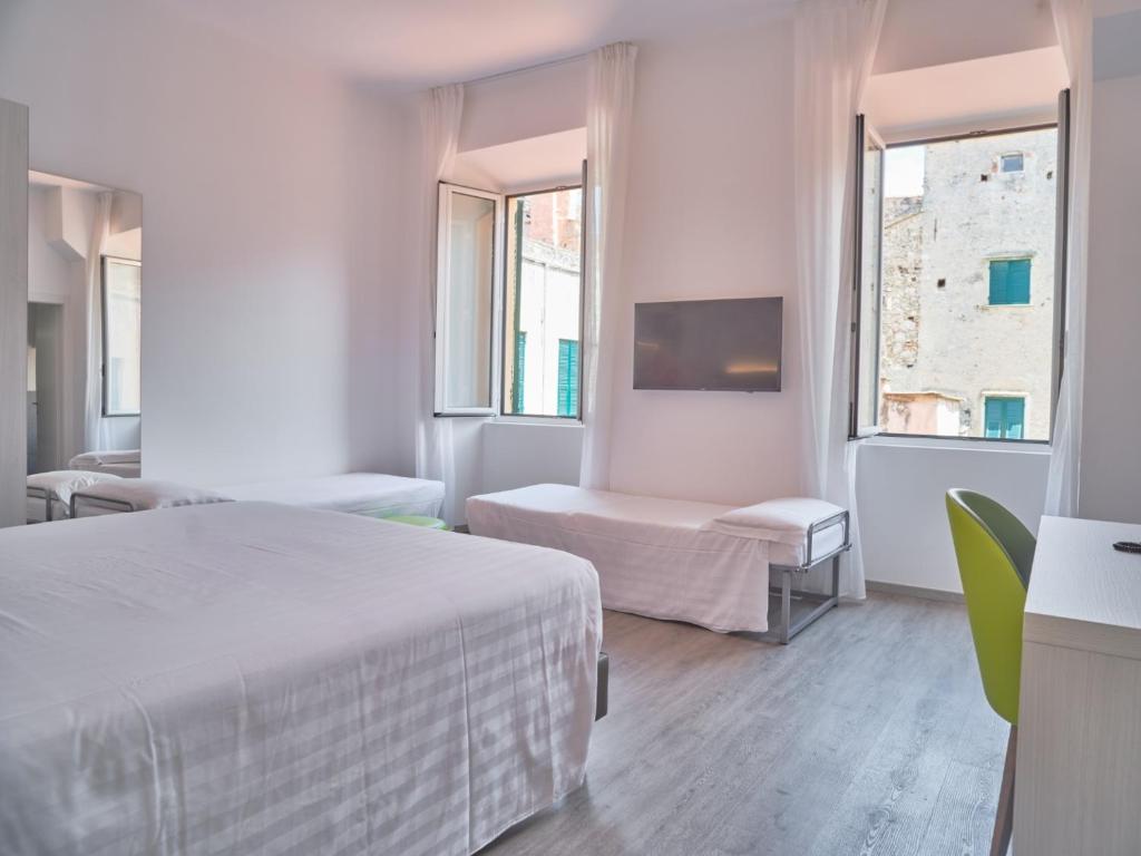 Кровать или кровати в номере Hotel Medusa