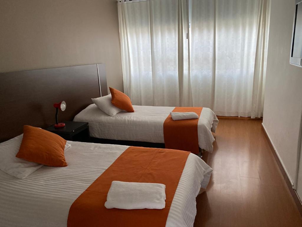 Postel nebo postele na pokoji v ubytování Hotel Juliette Bogota
