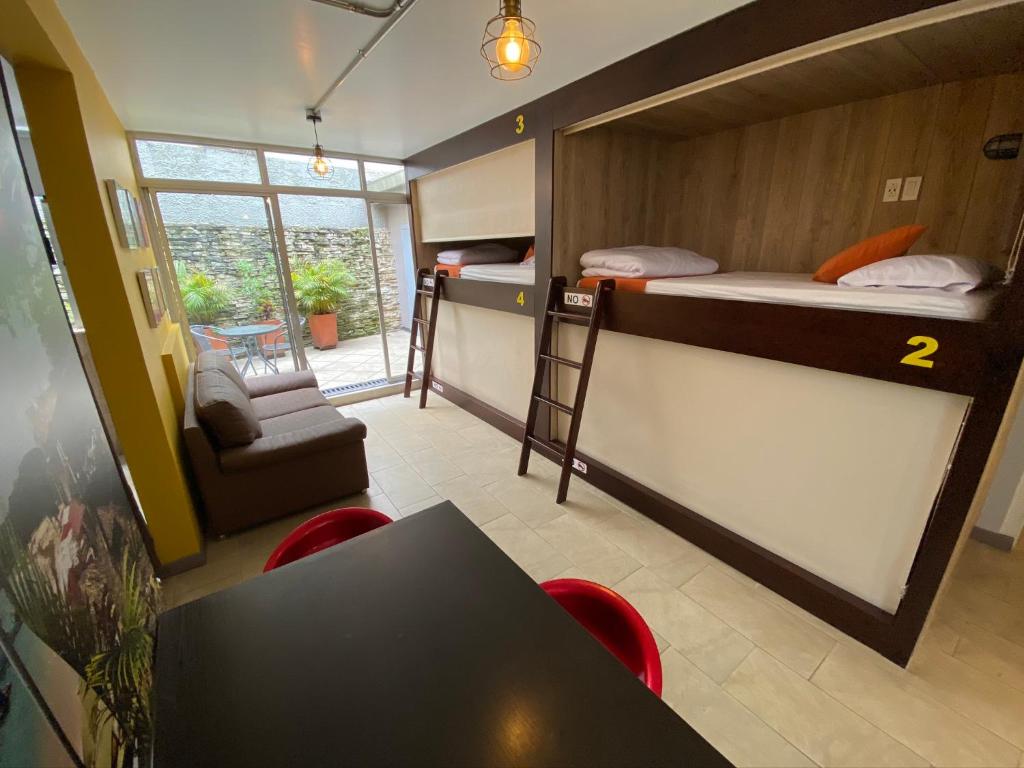 Postel nebo postele na pokoji v ubytování Hotel Juliette Bogota
