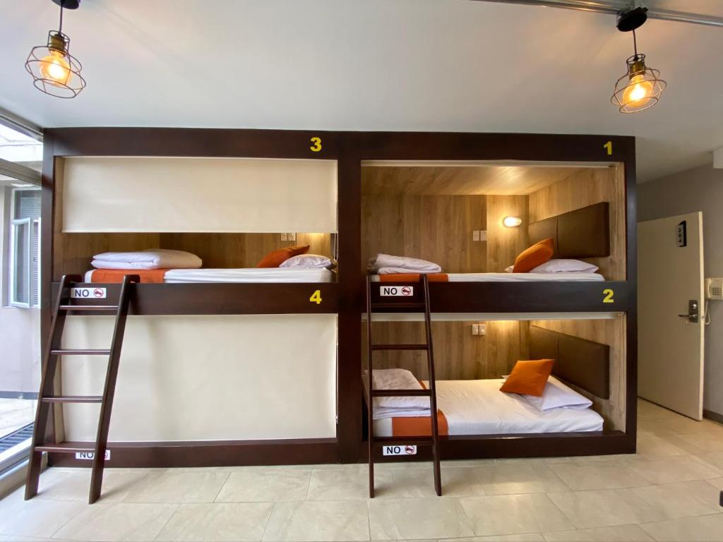 Postel nebo postele na pokoji v ubytování Hotel Juliette Bogota