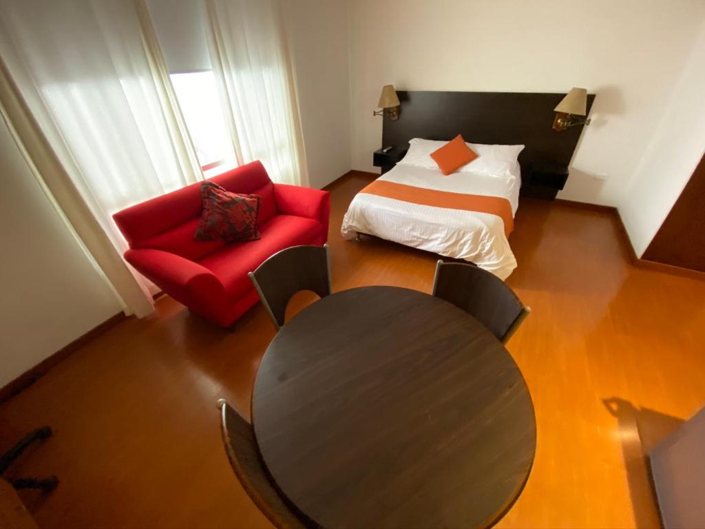 Postel nebo postele na pokoji v ubytování Hotel Juliette Bogota