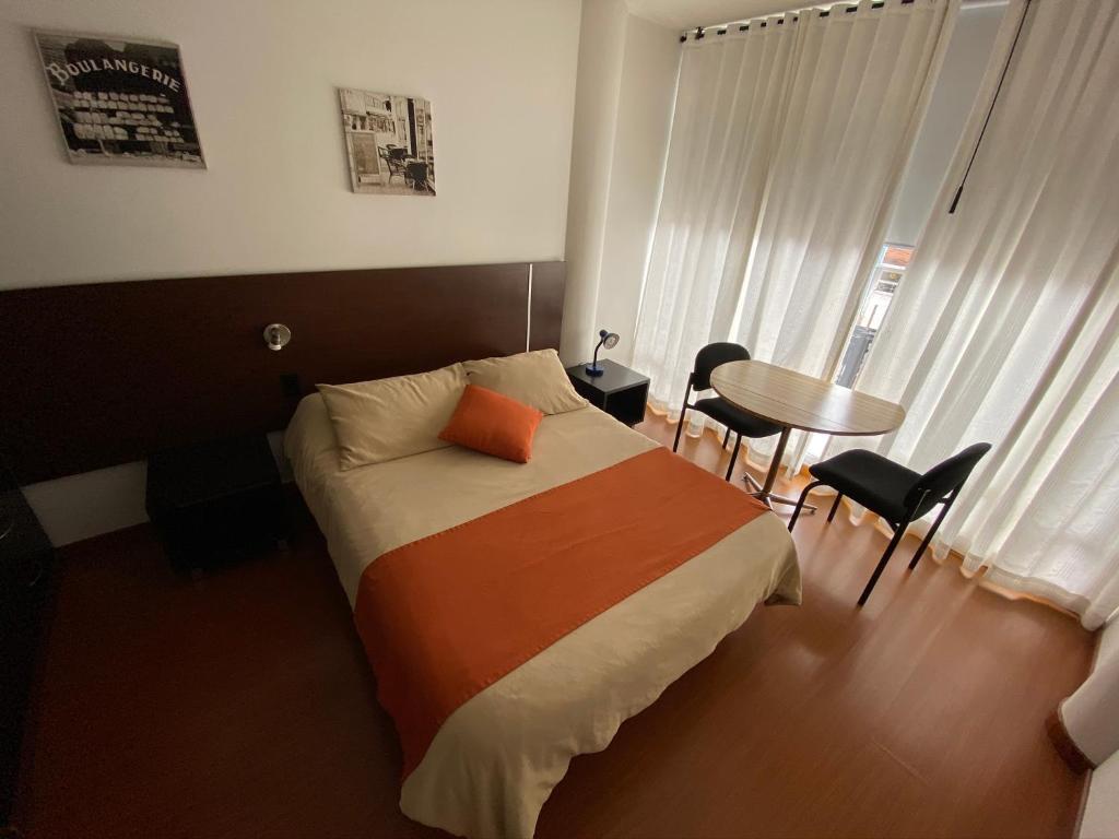 Postel nebo postele na pokoji v ubytování Hotel Juliette Bogota