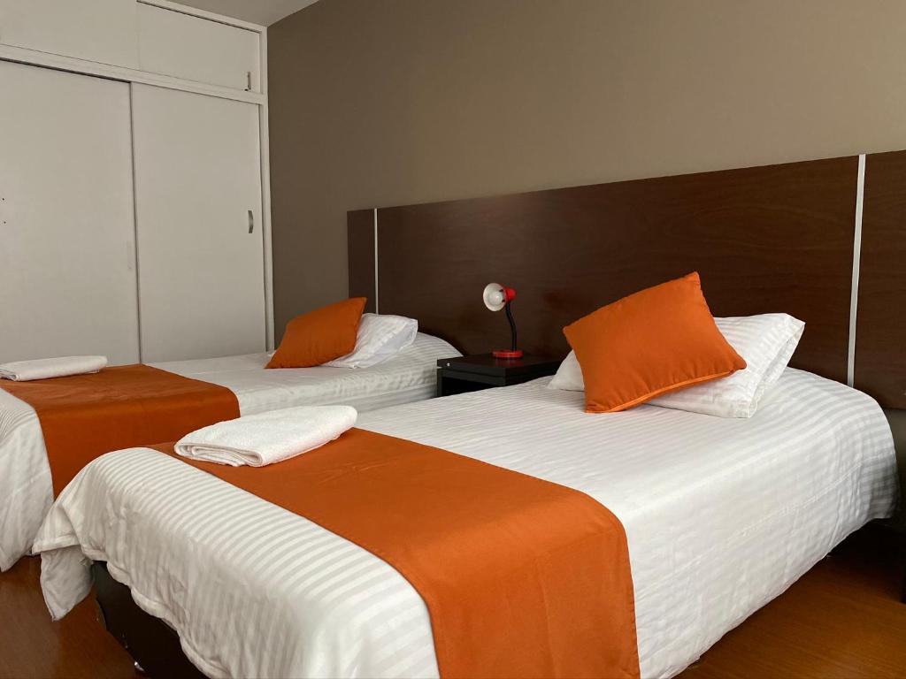 Postel nebo postele na pokoji v ubytování Hotel Juliette Bogota