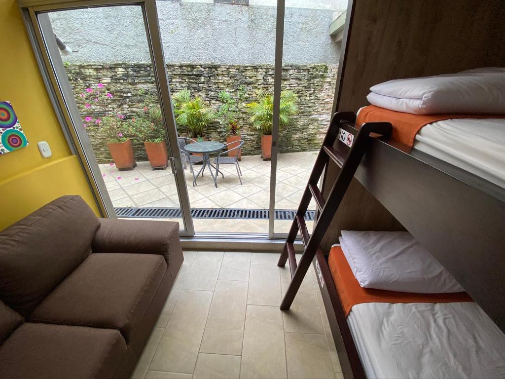 Postel nebo postele na pokoji v ubytování Hotel Juliette Bogota