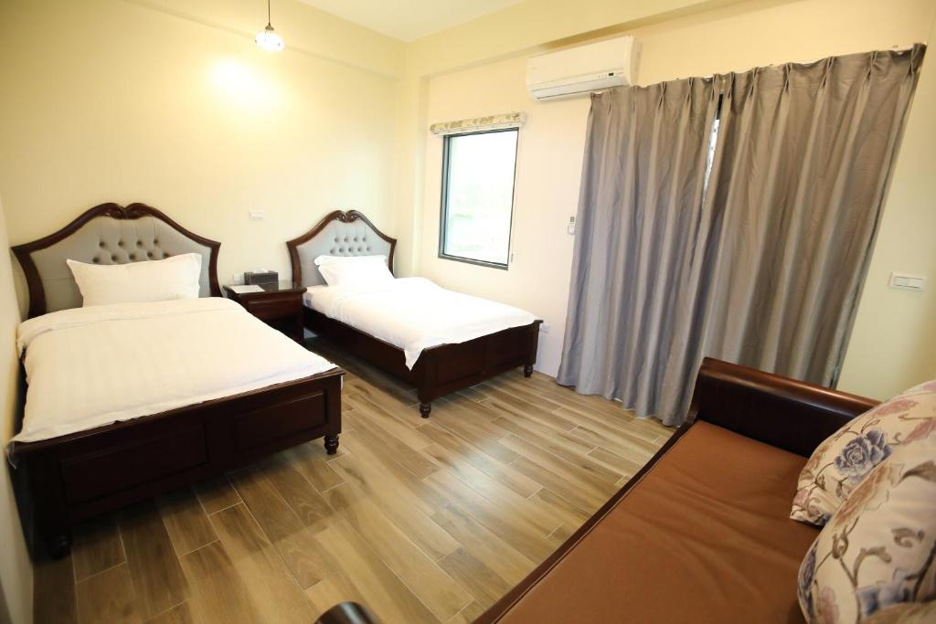 Postel nebo postele na pokoji v ubytování 出門獺踏 Otter footprints B&B