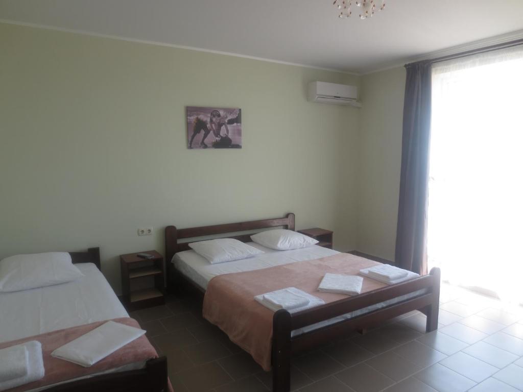 Postel nebo postele na pokoji v ubytování Hotel Golden Beach