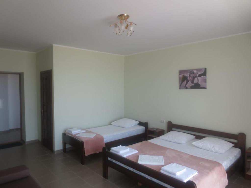 Postel nebo postele na pokoji v ubytování Hotel Golden Beach