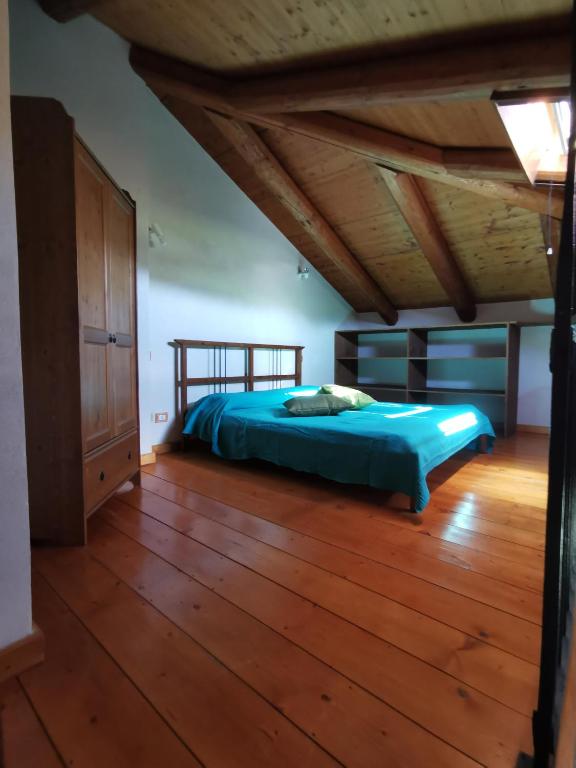 A bed or beds in a room at Agriturismo Mondo