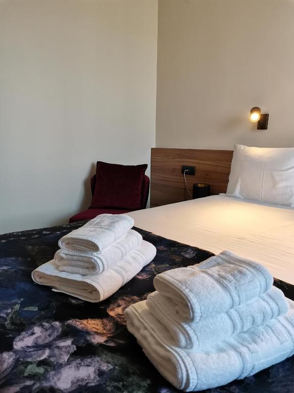 Postel nebo postele na pokoji v ubytování Hotel Aloha