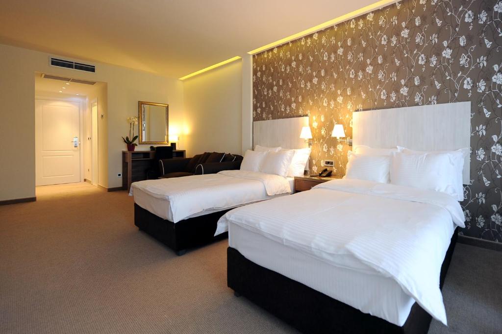 Postel nebo postele na pokoji v ubytování Hotel 1000 Ruza