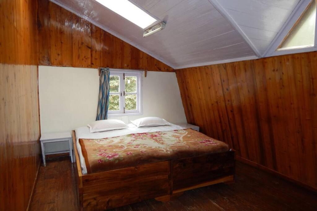 Postel nebo postele na pokoji v ubytování Pradhan's Cottages