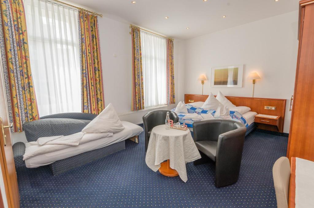 Postel nebo postele na pokoji v ubytování Inselhotel Cornelius