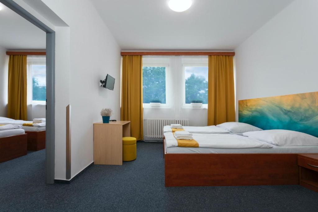 Postel nebo postele na pokoji v ubytování Hotel AMITY