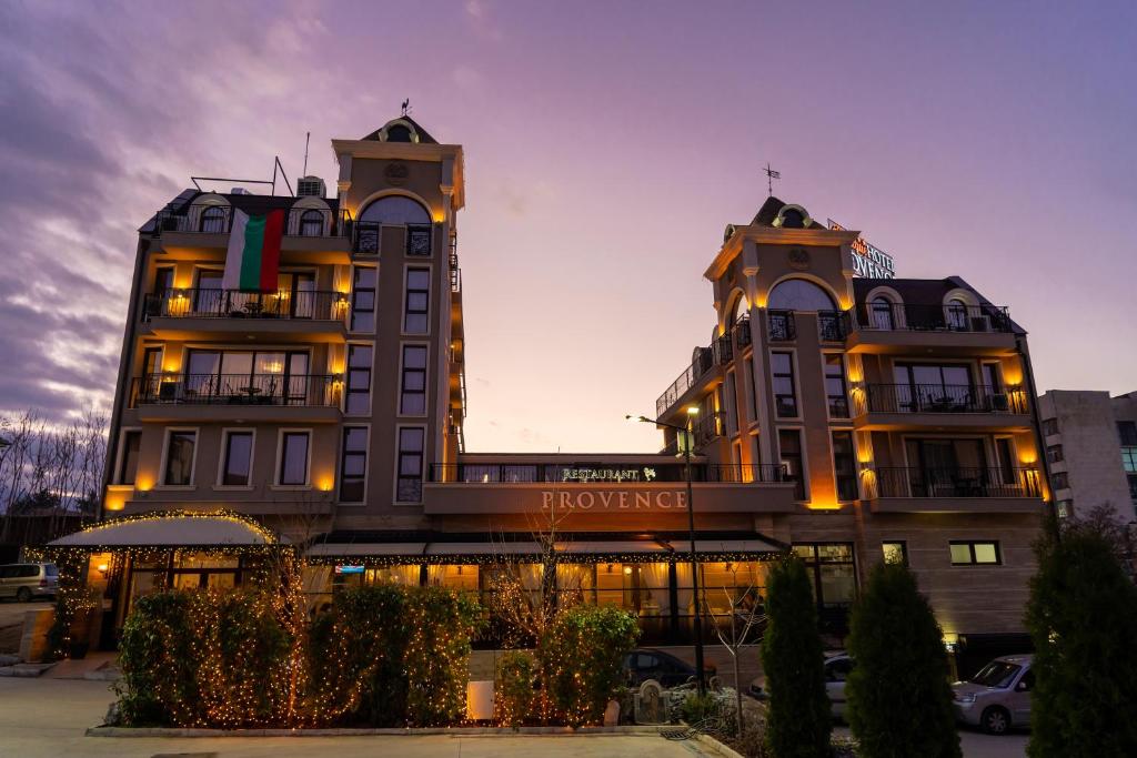 a large building with two towers on top of it at Boutique hotel Provence Бутик хотел Прованс in Petrich