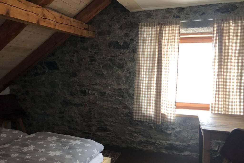 Letto o letti in una camera di Loft 100m2, im Ökohaus in Susch
