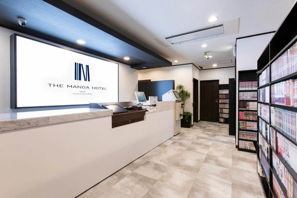 a waiting room at the maven hotel with a projection screen at THE MANGA HOTEL TOGO in Togo