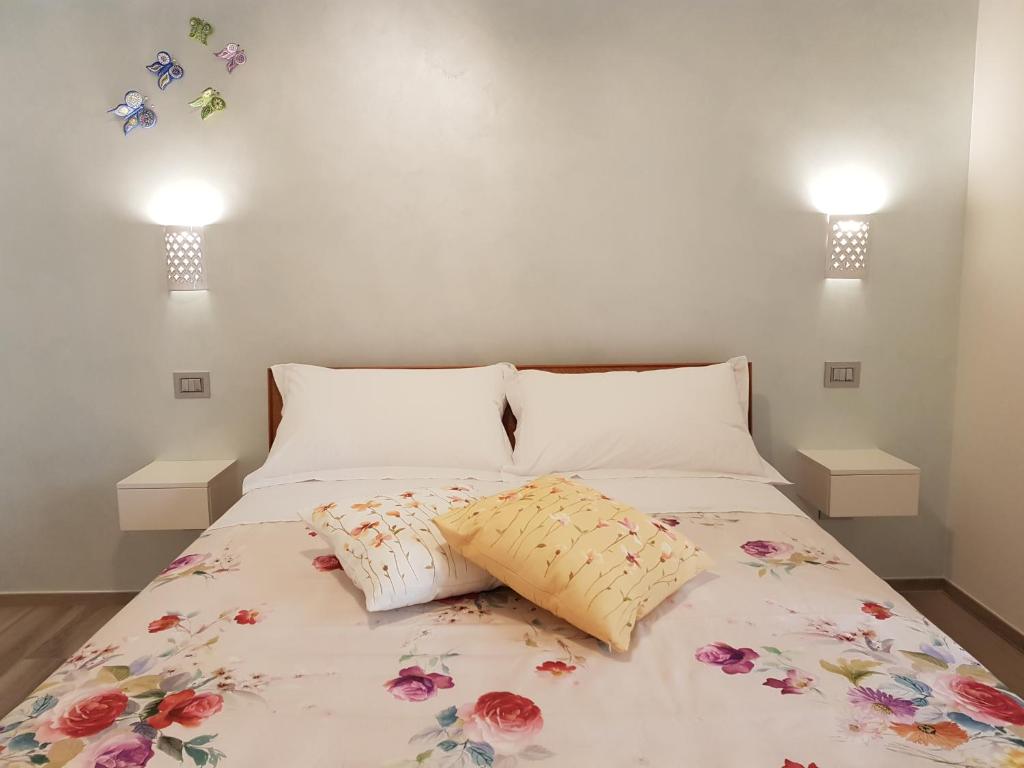 a bedroom with a bed with two pillows on it at RosAmar in Bari