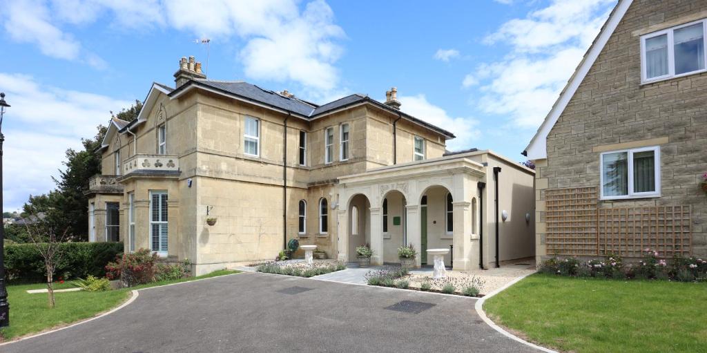a large house with a driveway in front of it at Tyndall Villa Boutique B&B in Bath