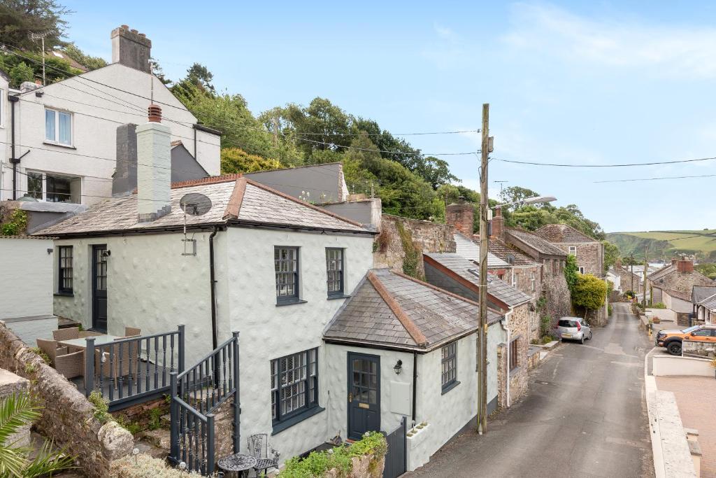 a view of a village street with houses at Lime Kiln Cottage, Pentewan, Cornwall in Pentewan