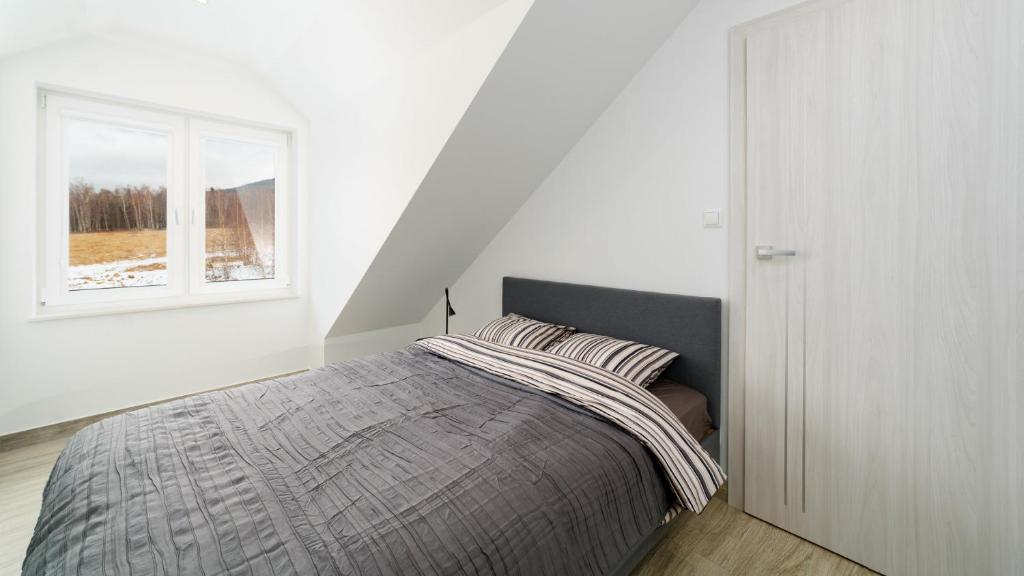 Posteľ alebo postele v izbe v ubytovaní Apartamenty EverySky - Dom Orkana 9