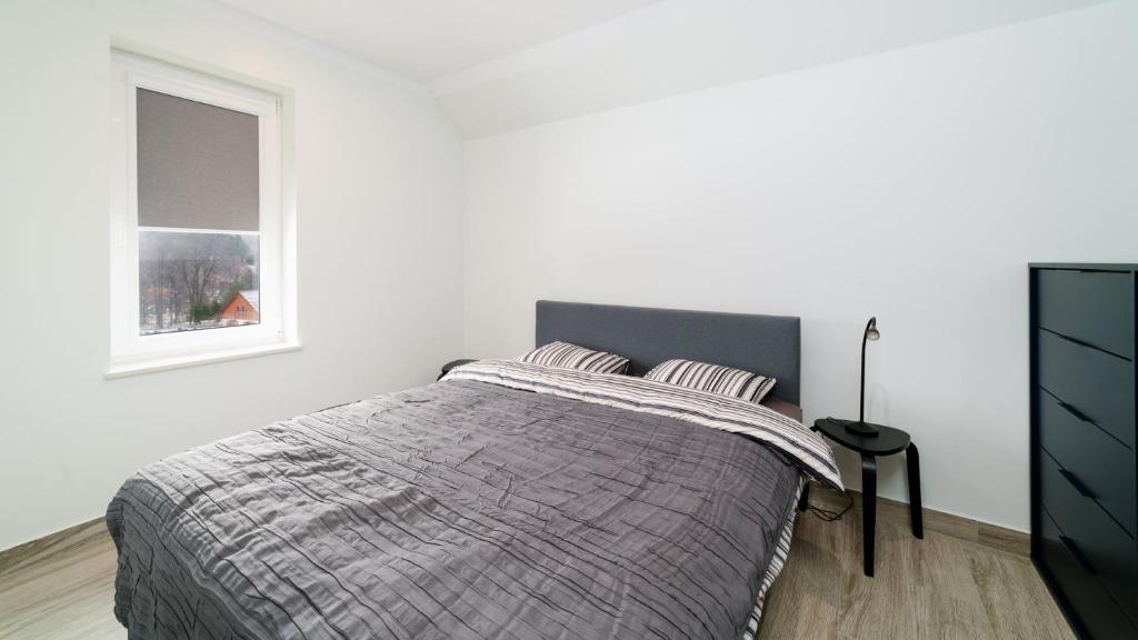 Posteľ alebo postele v izbe v ubytovaní Apartamenty EverySky - Dom Orkana 9