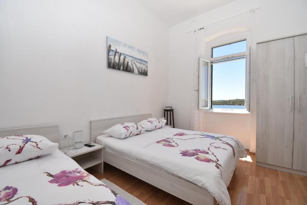 Кровать или кровати в номере Apartmani Rina