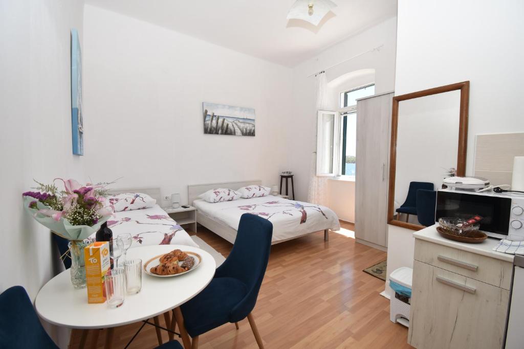 Кровать или кровати в номере Apartmani Rina
