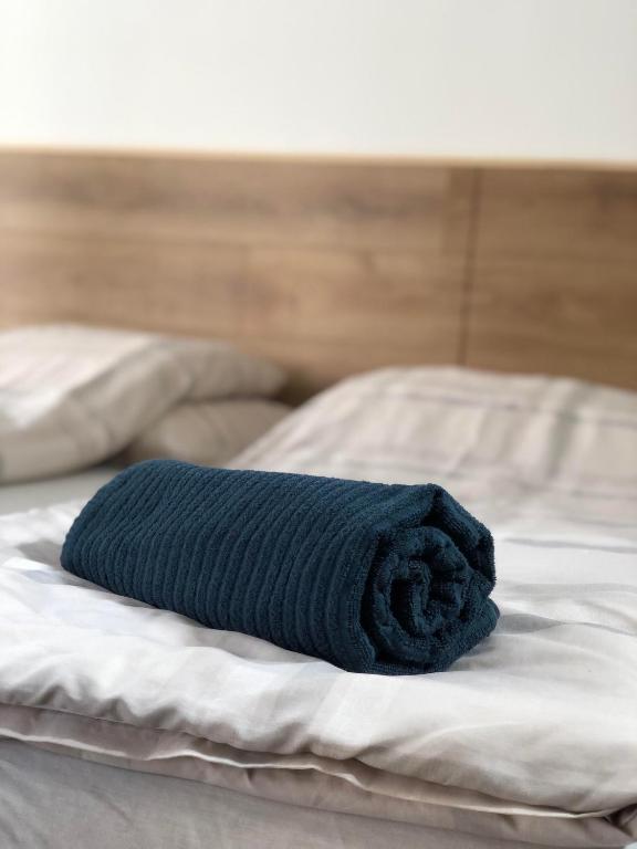 Łóżko lub łóżka w pokoju w obiekcie Avas Apartman