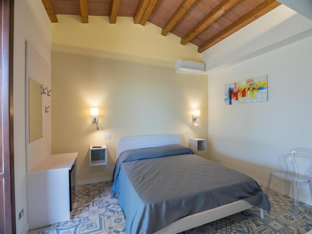 Postel nebo postele na pokoji v ubytování B&B Il Gelso Rooms